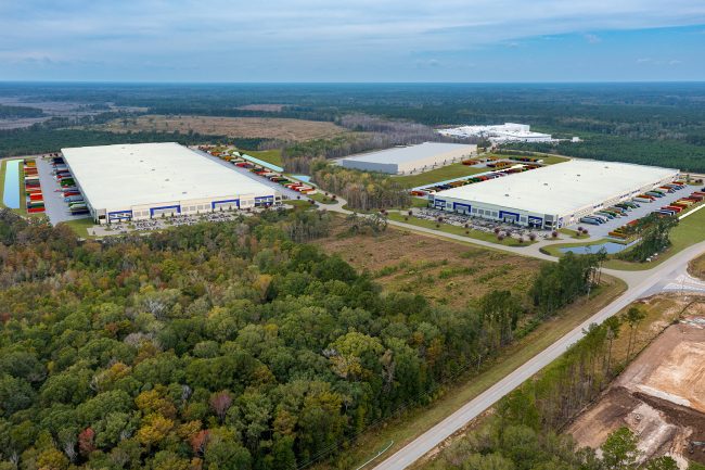 Birdseye view of rendered warehouses and drone photography.